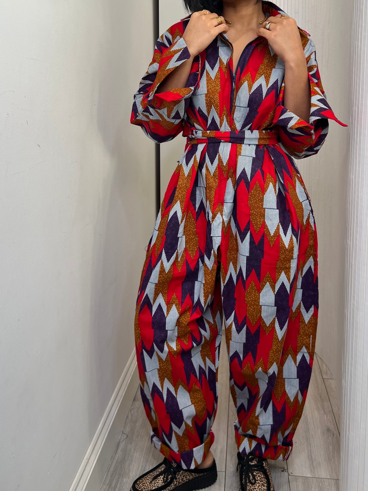 African print long sleeve jumpsuit. Red and navy kente UK size 1 8-14/16