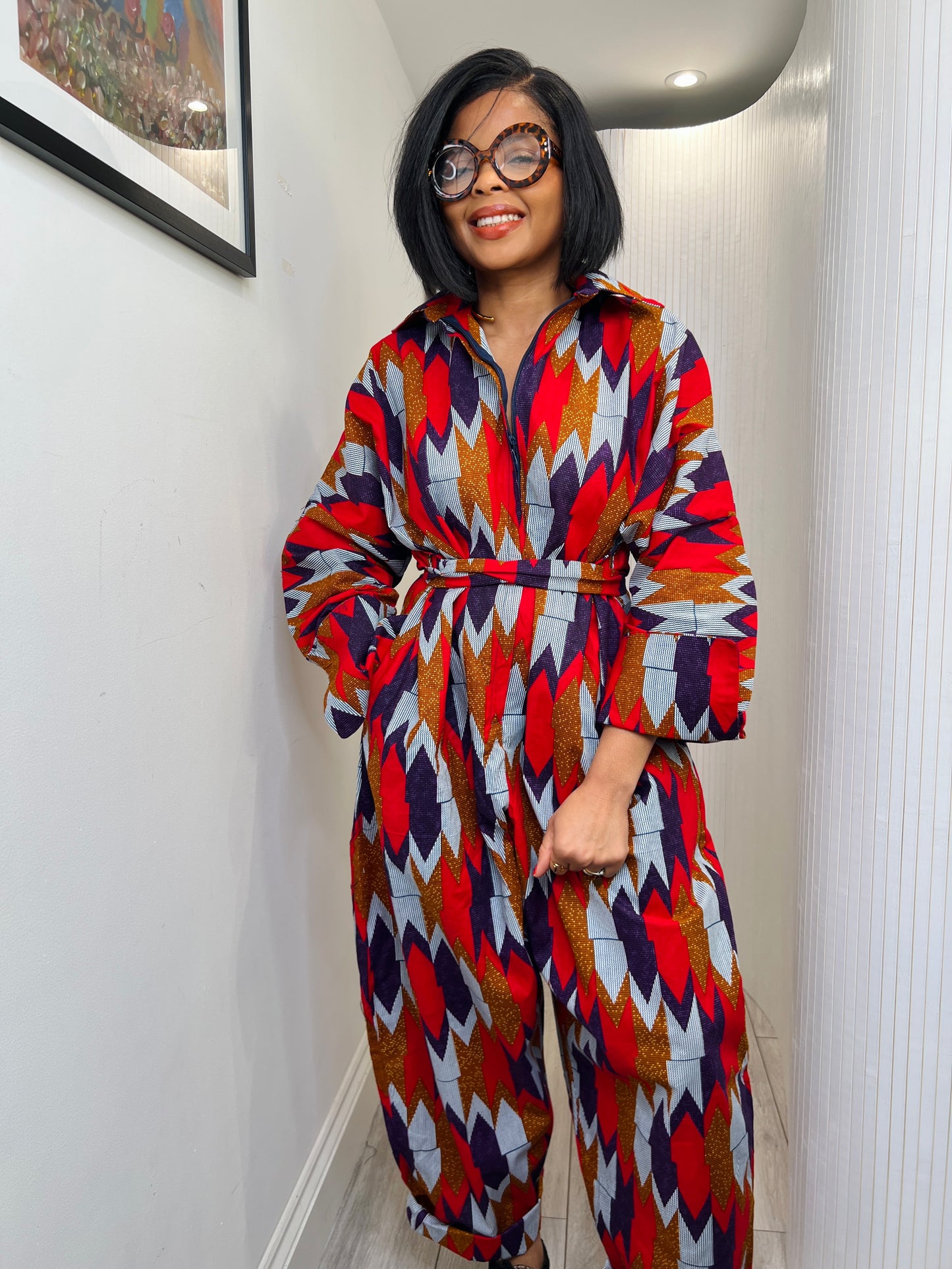 African print long sleeve jumpsuit. Red and navy kente UK size 1 8-14/16