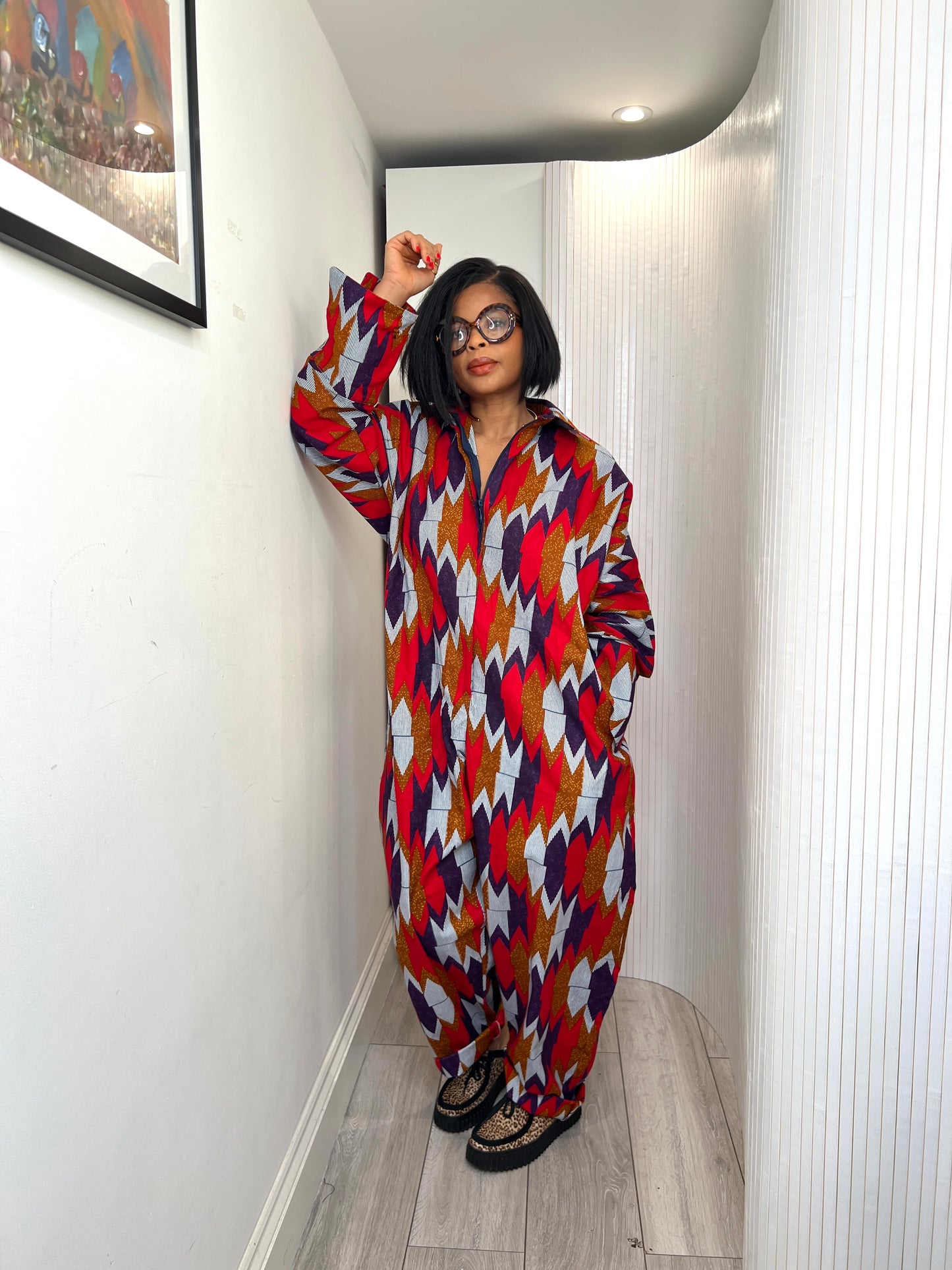 African print long sleeve jumpsuit. Red and navy kente UK size 1 8-14/16