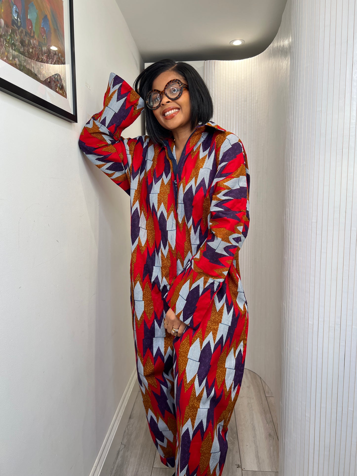 African print long sleeve jumpsuit. Red and navy kente UK size 1 8-14/16