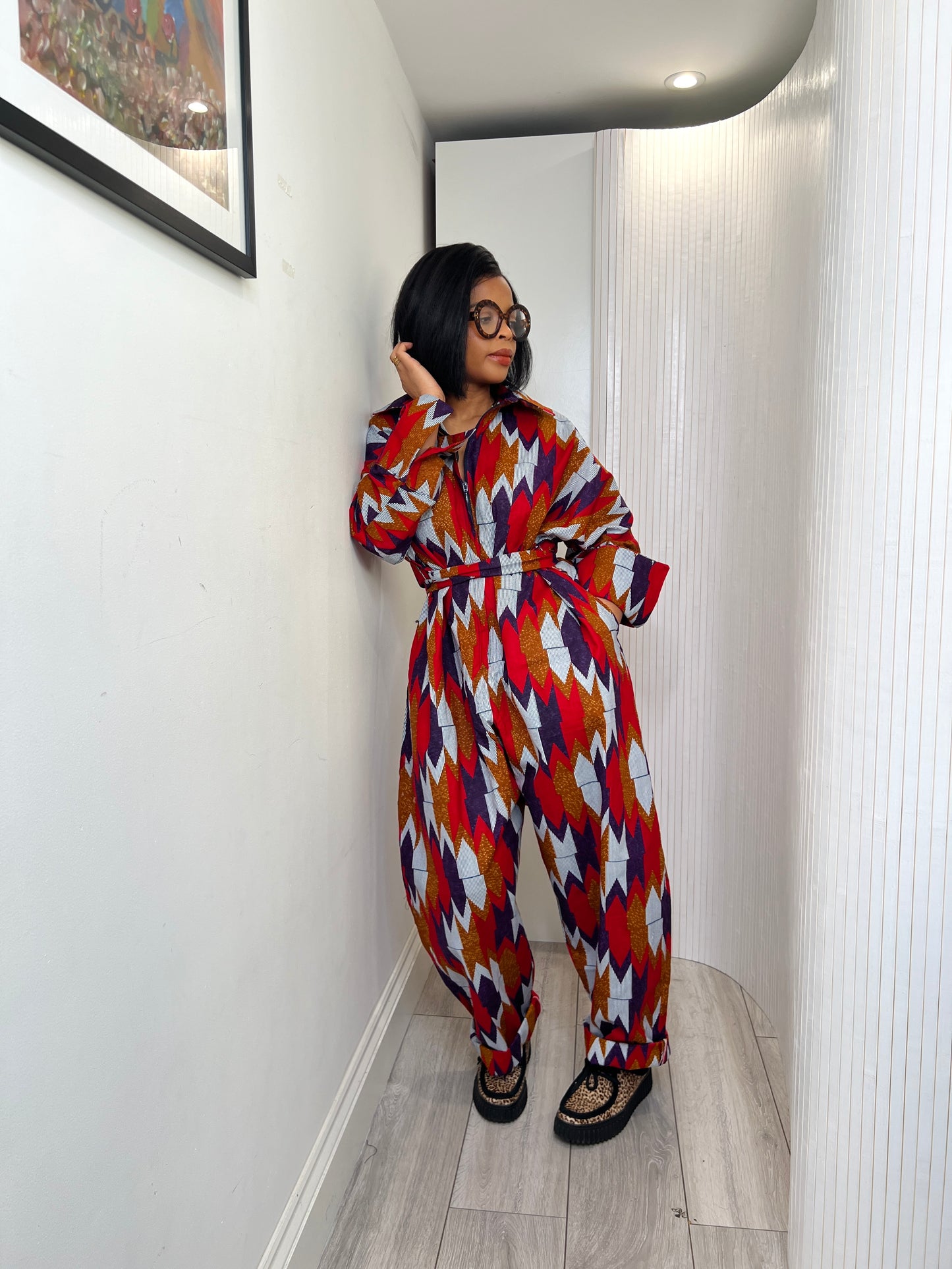 African print long sleeve jumpsuit. Red and navy kente UK size 1 8-14/16