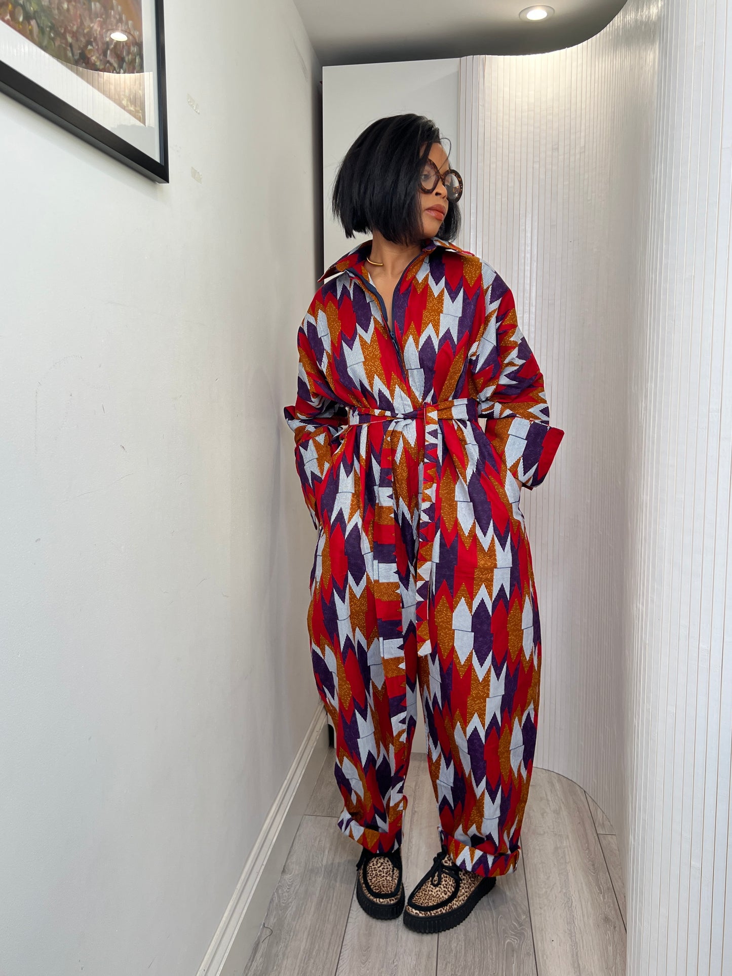 African print long sleeve jumpsuit. Red and navy kente UK size 1 8-14/16