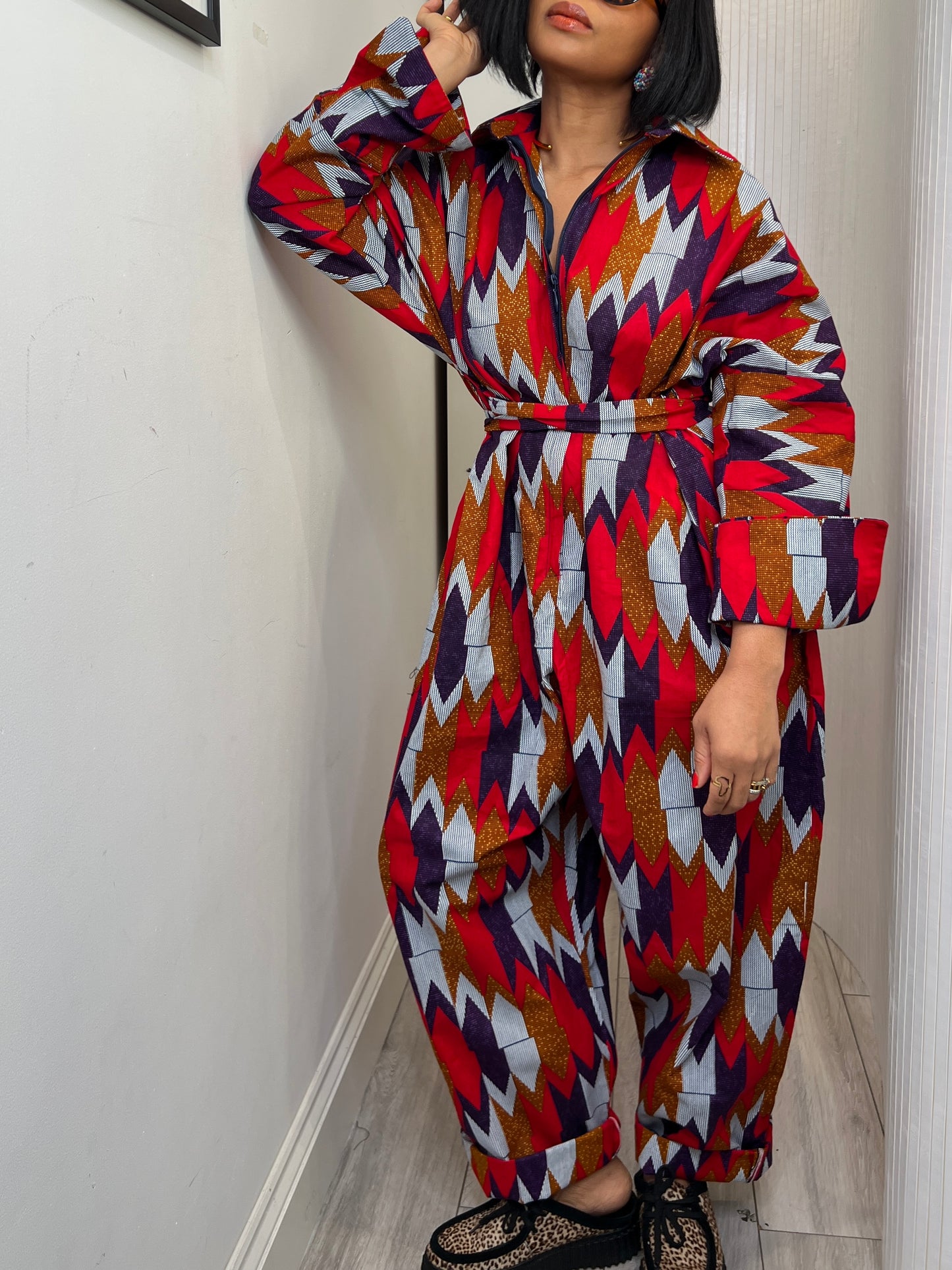African print long sleeve jumpsuit. Red and navy kente UK size 1 8-14/16