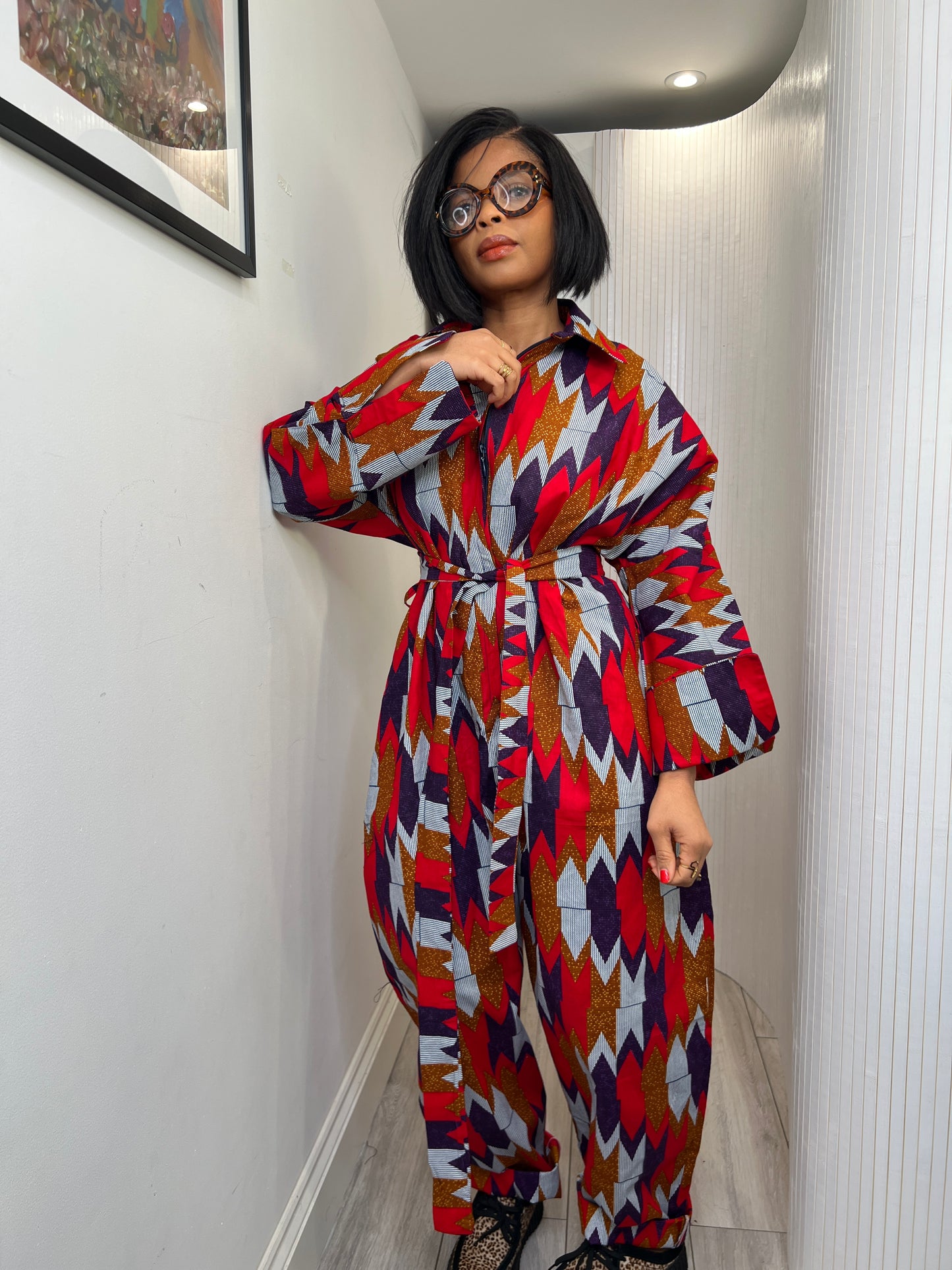 African print long sleeve jumpsuit. Red and navy kente UK size 1 8-14/16