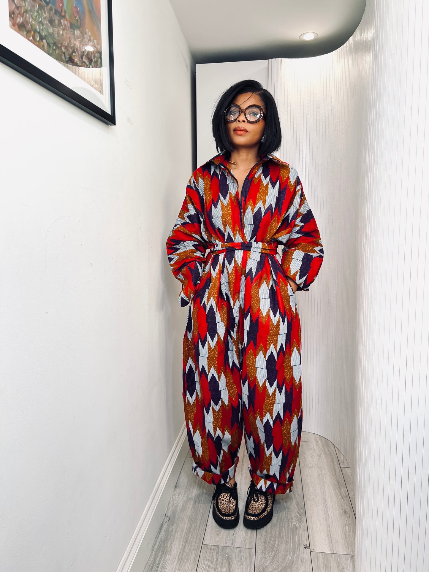 African print long sleeve jumpsuit. Red and navy kente UK size 1 8-14/16