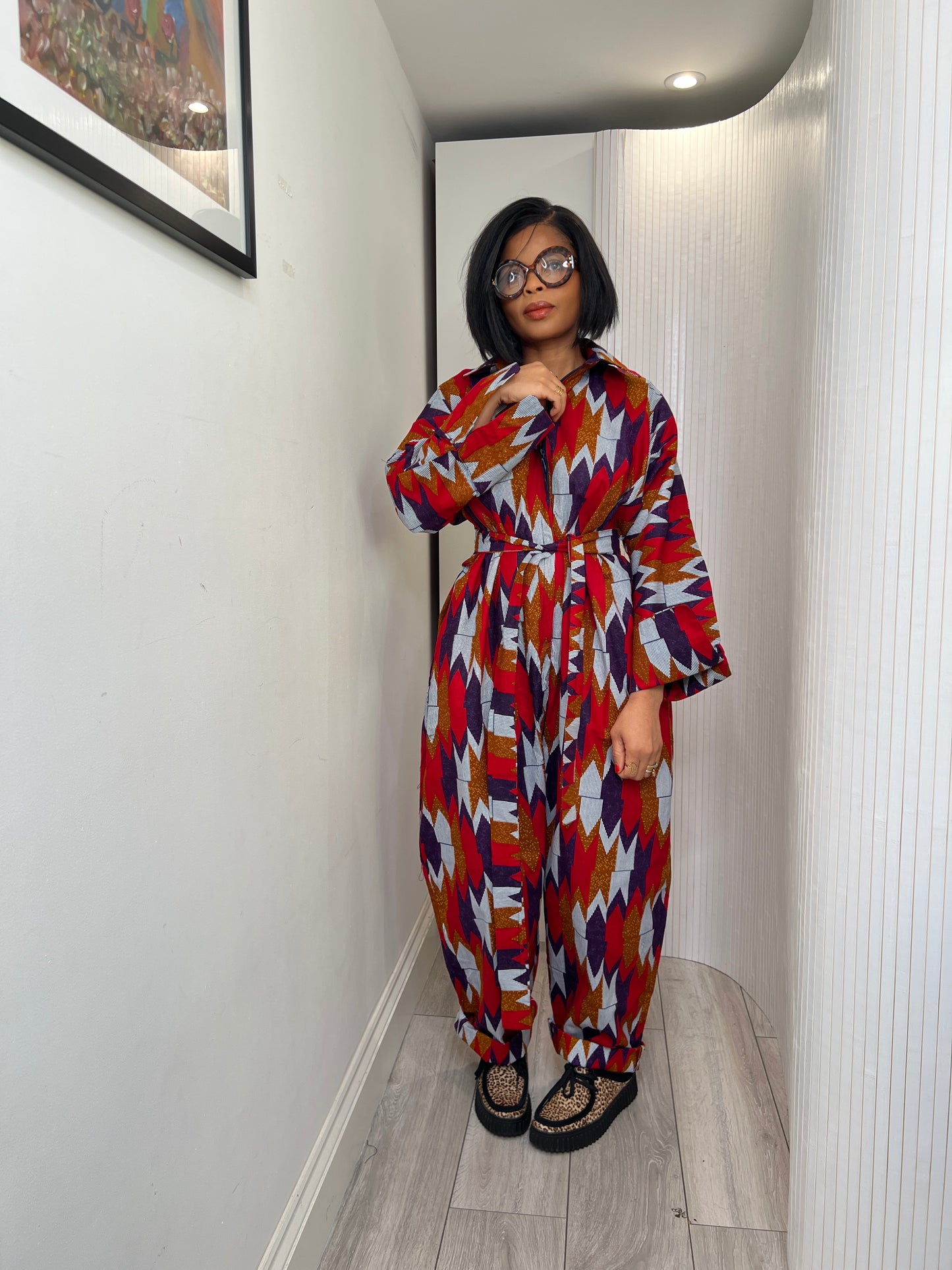 African print long sleeve jumpsuit. Red and navy kente UK size 1 8-14/16
