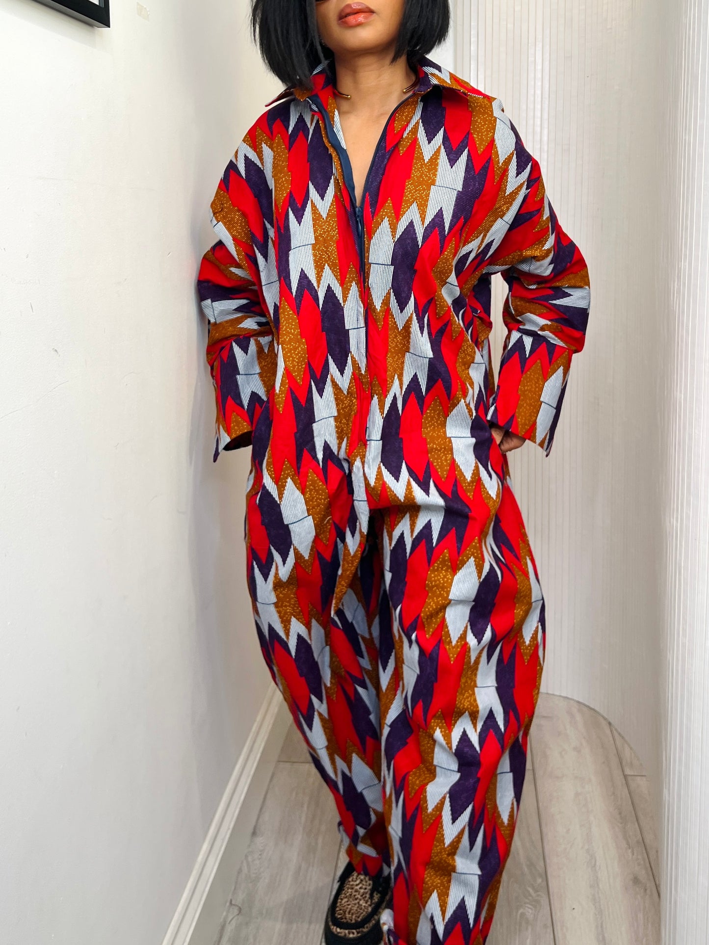 African print long sleeve jumpsuit. Red and navy kente UK size 1 8-14/16