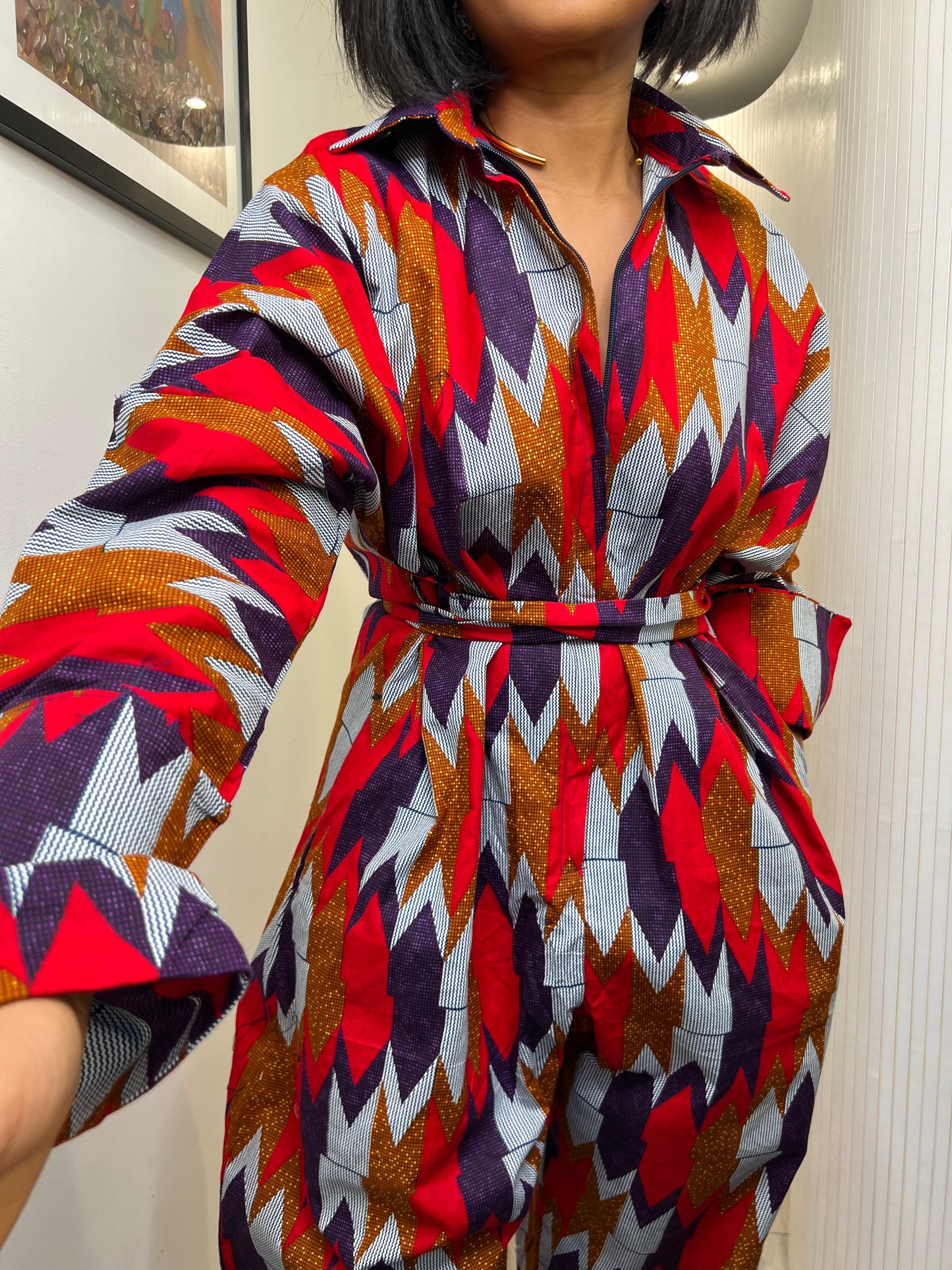 African print long sleeve jumpsuit. Red and navy kente UK size 1 8-14/16