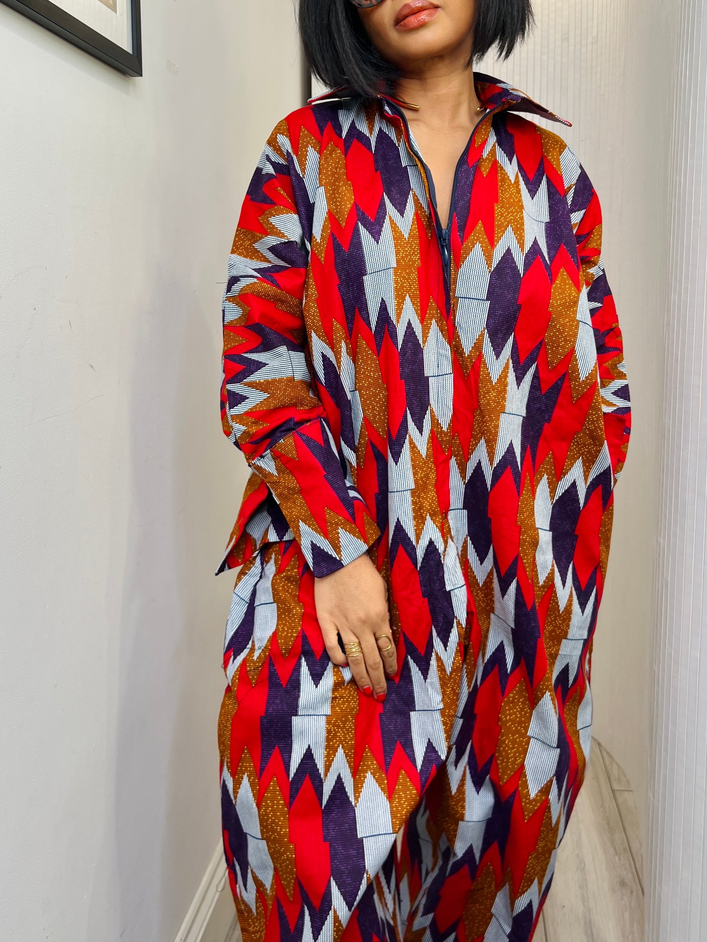 African print long sleeve jumpsuit. Red and navy kente UK size 1 8-14/16