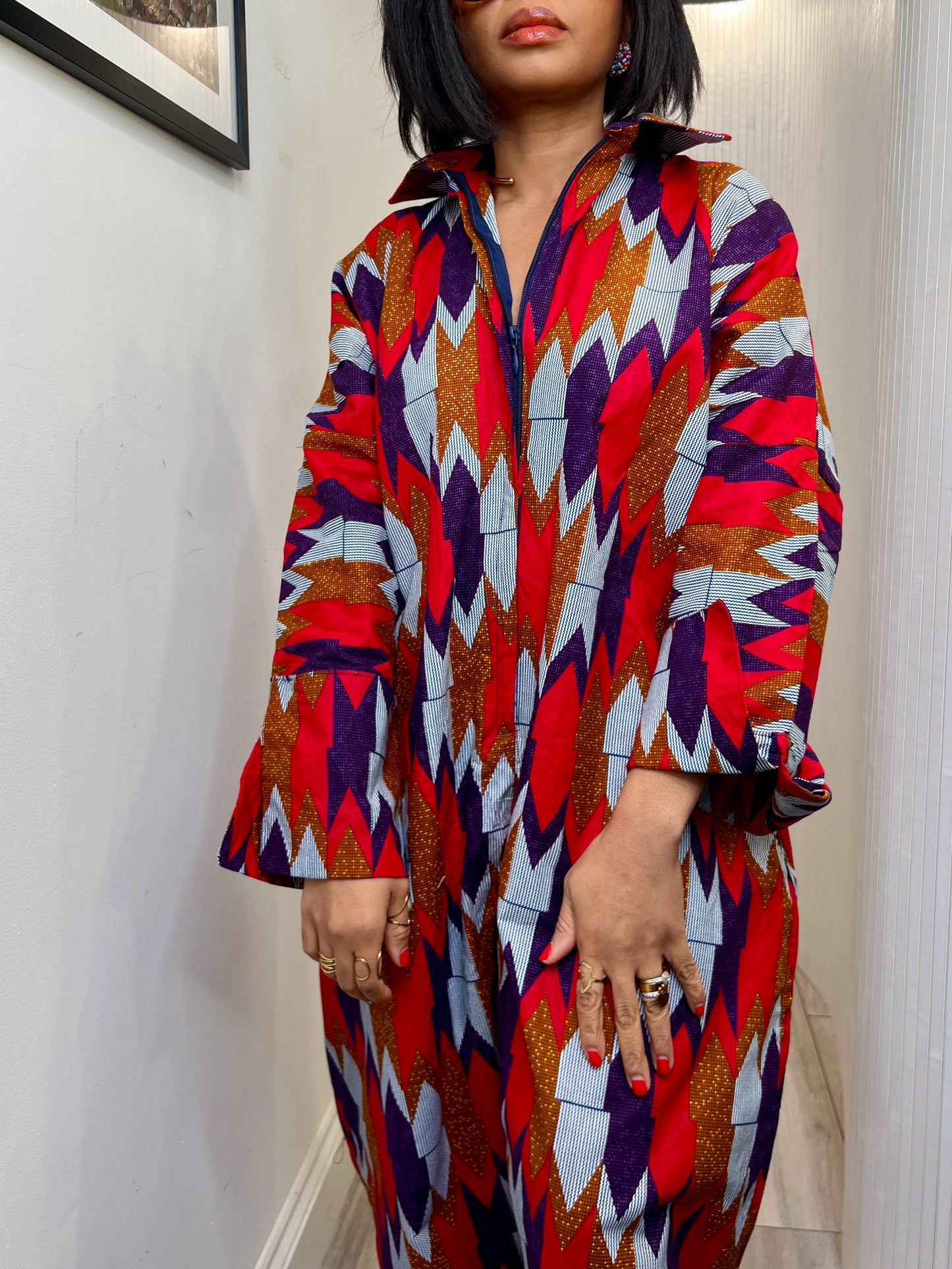 African print long sleeve jumpsuit. Red and navy kente UK size 1 8-14/16
