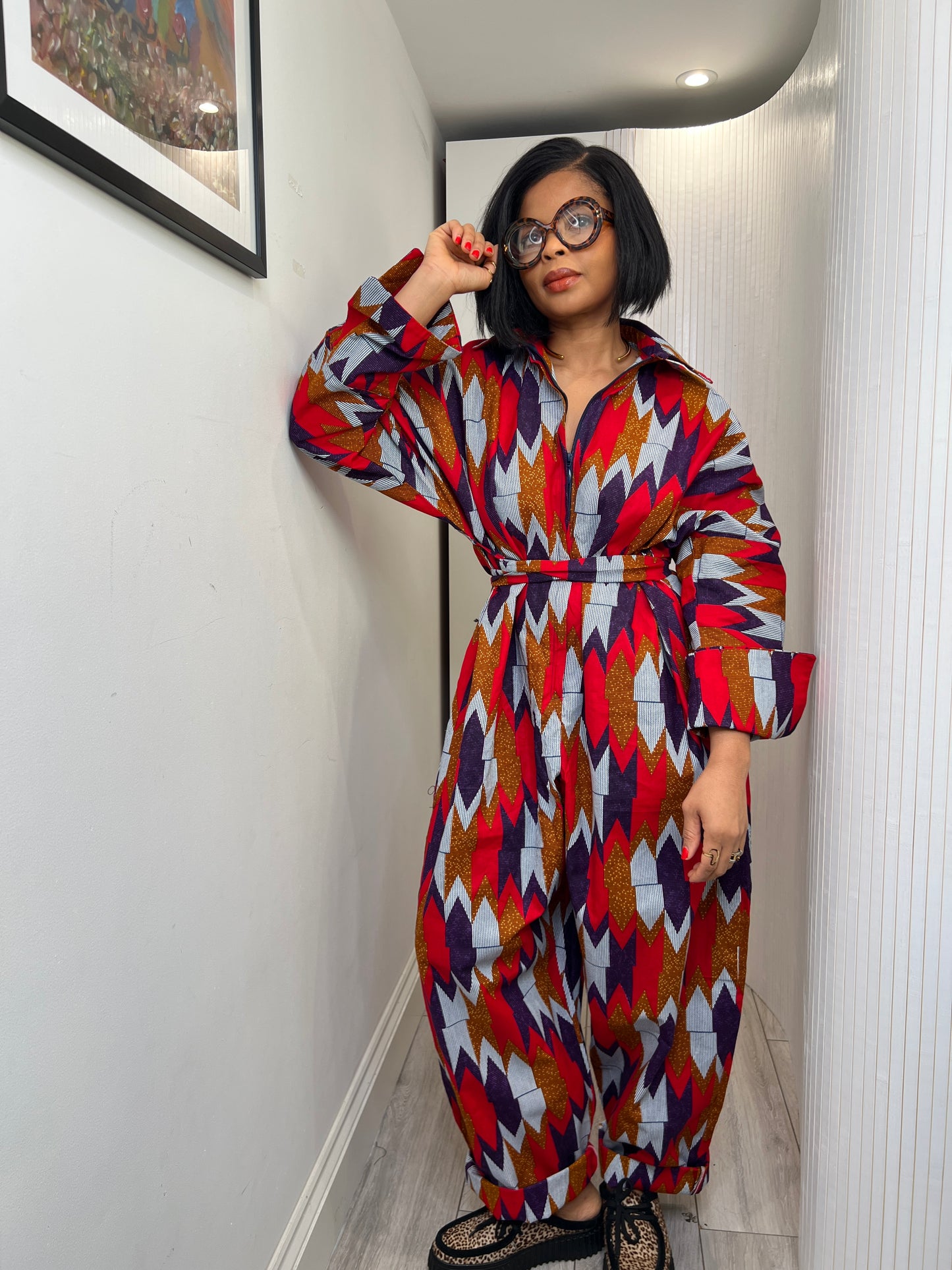 African print long sleeve jumpsuit. Red and navy kente UK size 1 8-14/16