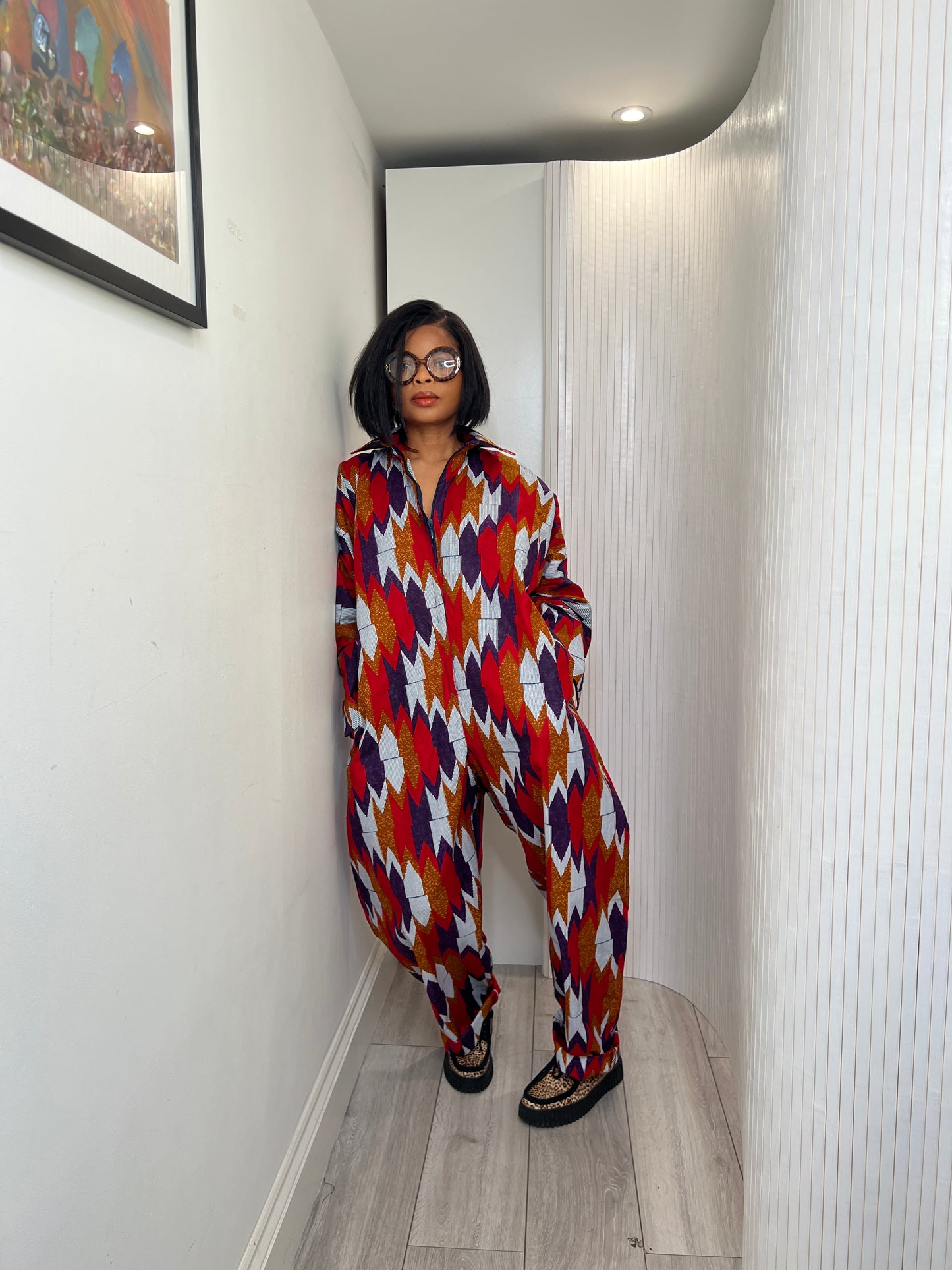 African print long sleeve jumpsuit. Red and navy kente UK size 1 8-14/16
