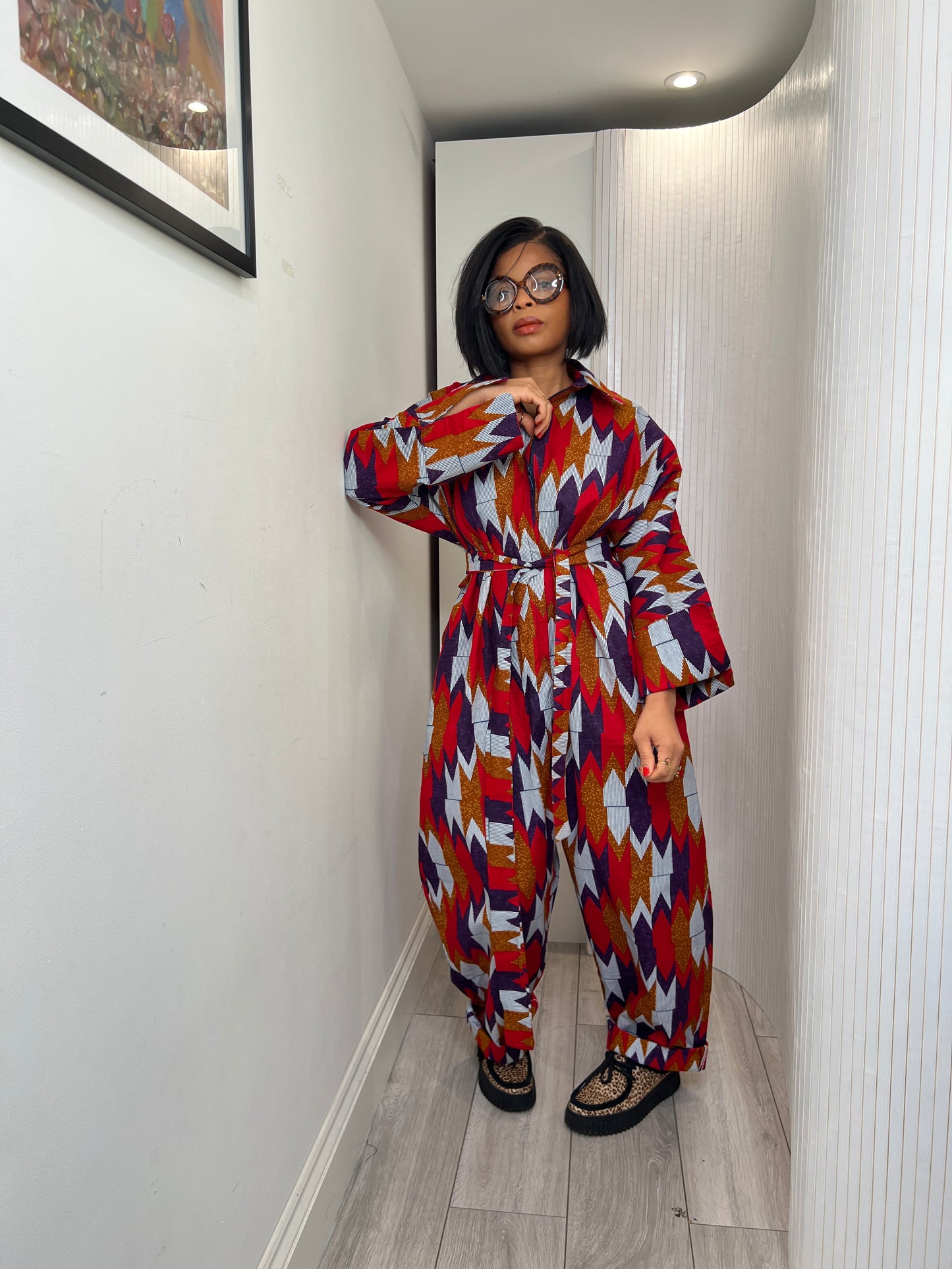 African print long sleeve jumpsuit. Red and navy kente UK size 1 8-14/16
