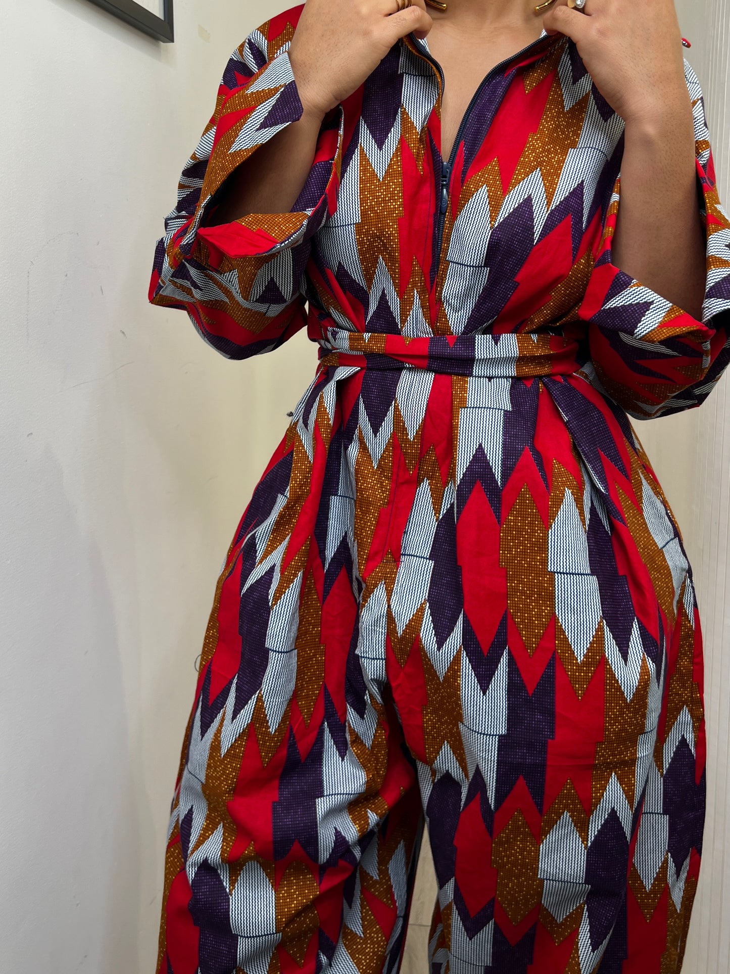 African print long sleeve jumpsuit. Red and navy kente UK size 1 8-14/16
